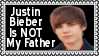 A black stamp with a white border with a picture of a young Justin Bieber and white text that reads Justin Bieber is NOT my father