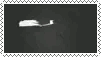 A stamp with a white border and a grey background. White text appears that reads MCR with the Danger Days album cover appearing behind the text.