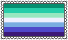 A stamp of a the gay male flag, it is a seven striped flag with three shades of teal-ish green on the top, white in the middle, and three shades of blue on the bottom. The greens and blues are lighter as they approach the centre. The stamp has a white border.