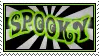A stamp with black and white radiatng stripes. There is the word spooky in green, curly, halloween-ish text with a black outline overlayed on the stripes.