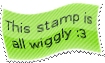A green stamp with a distorted shape. Instead of being a rectangle, the stamp is bent. It has a white border and black text which reads This stamp is all wiggly :3