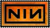A stamp with a black border with the Nine Inch Nails logo on an orange background. The logo features the letters NIN in bold black writing. The N on the right is backwards and the text is surrounded with a bold black rectangle.