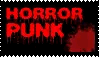 A black stamp with the words horror punk on it in red. Red splatter marks appear on the stamp, covering the writing.