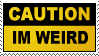 A split black and yellow stamp with a white border. In the black part there is yellow text that reads caution in capital letters. In the yellow part there is black text which reads I'm weird, also in capital letters.